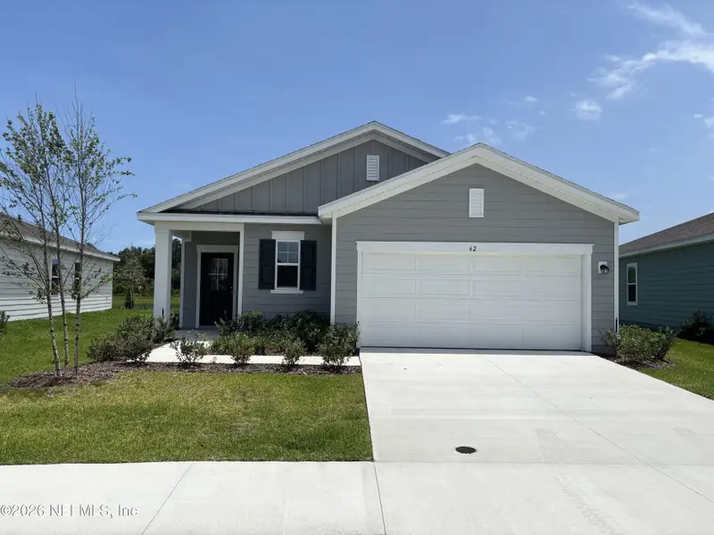 Front exterior of a new home in , Palm Coast, FL, highlighting curb appeal (Image 1). Front exterior of a new home in , Palm Coast, FL, highlighting curb appeal (Image 1).
