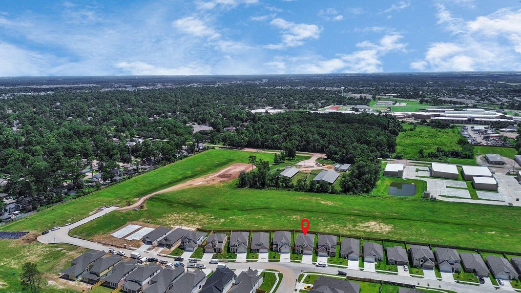 An aerial view of a spacious subdivision lot, highlighting a well-maintained yard and a fully fenced perimeter, offering both privacy and expansive outdoor space. An aerial view of a spacious subdivision lot, highlighting a well-maintained yard and a fully fenced perimeter, offering both privacy and expansive outdoor space.