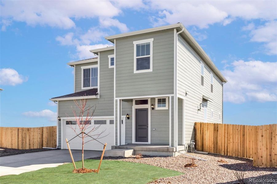 Front exterior of a new home in , Commerce City, CO, highlighting curb appeal (Image 1).