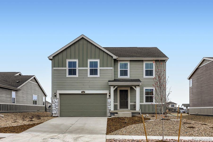 Front exterior of a new home in Percheron: The Camden Collection, Colorado Springs, CO, highlighting curb appeal (Image 1).