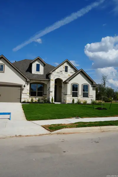 Front exterior of a new home in Buffalo Crossing, Schertz, TX, highlighting curb appeal (Image 2). Front exterior of a new home in Buffalo Crossing, Schertz, TX, highlighting curb appeal (Image 2).