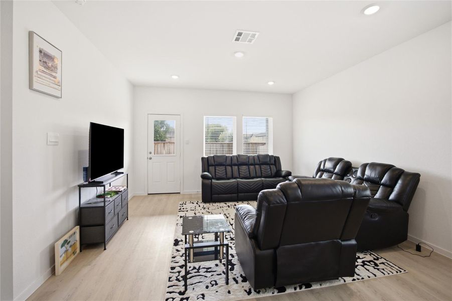 Living room view — Bright living area with natural light. Living room view — Bright living area with natural light.