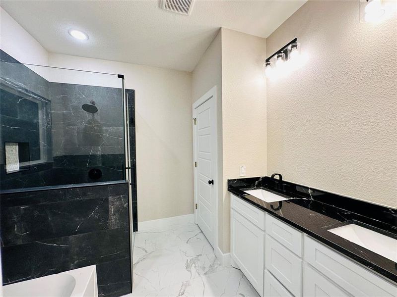 Double sinks for convenience & a walk-in shower!