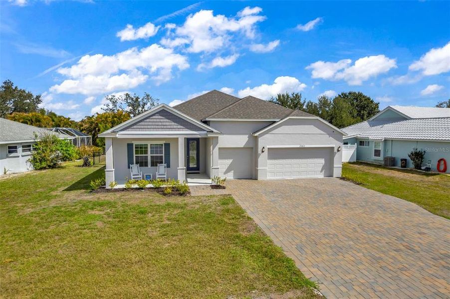 Front exterior of a new home in , Punta Gorda, FL, highlighting curb appeal (Image 30).