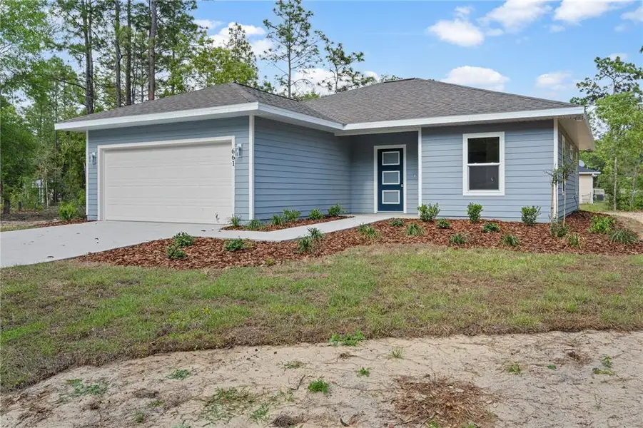 Front exterior of a new home in , Williston, FL, highlighting curb appeal (Image 1). Front exterior of a new home in , Williston, FL, highlighting curb appeal (Image 1).