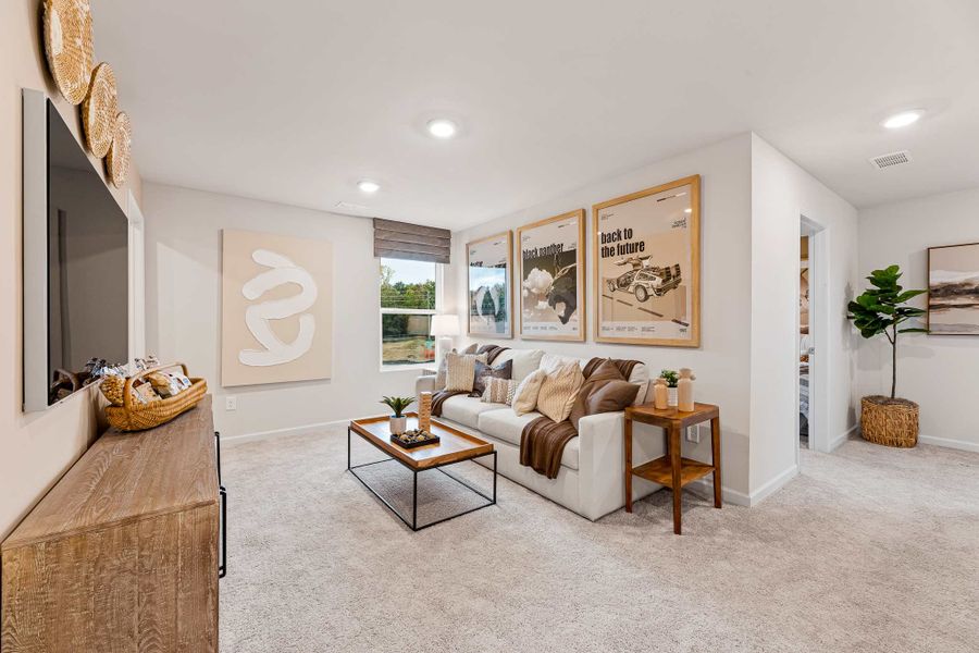 A living room with a couch and a coffee table.
