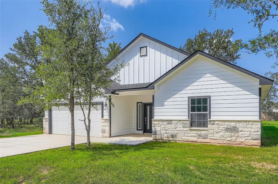 View of front lawn and driveway,