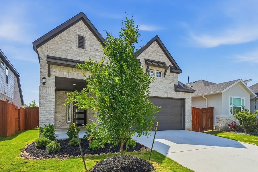 Front exterior of a new home in Stillwater Ranch, San Antonio, TX, highlighting curb appeal (Image 23).