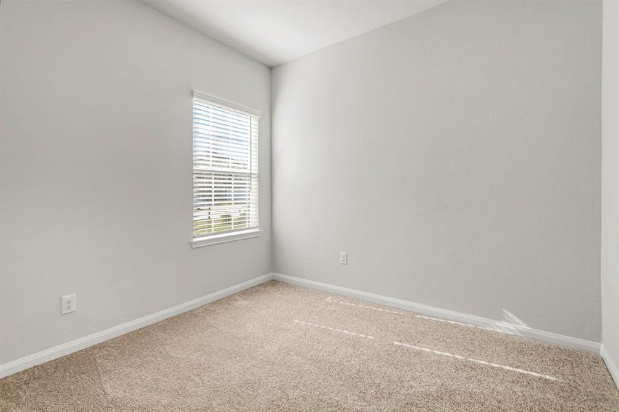 The secondary bedroom is cozy and spacious.