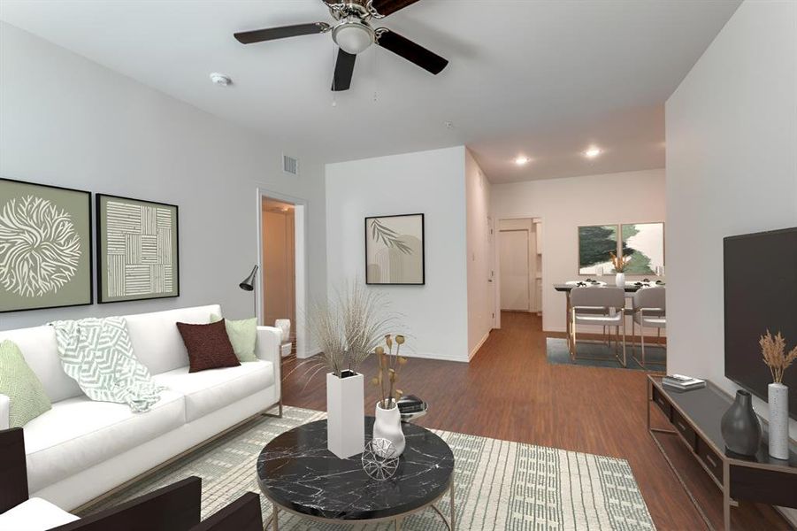 Living room with ceiling fan, high ceilings