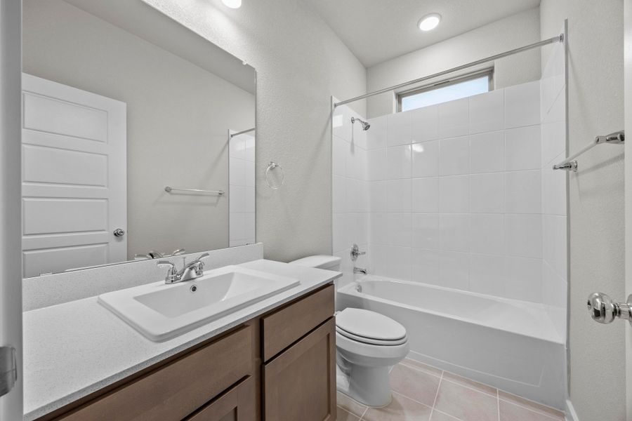 Bathroom in the Cedar home plan by Trophy Signature Homes – REPRESENTATIVE PHOTO