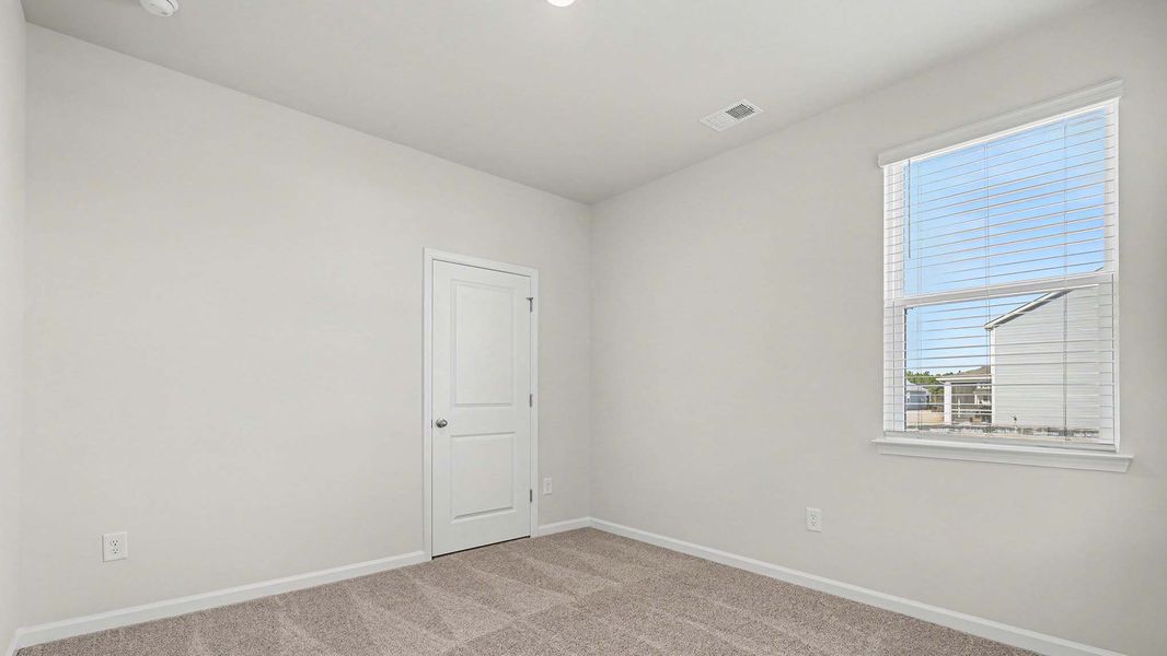 Spacious, unfurnished interior of a new home in Auberon Woods, Conway (Image 14).