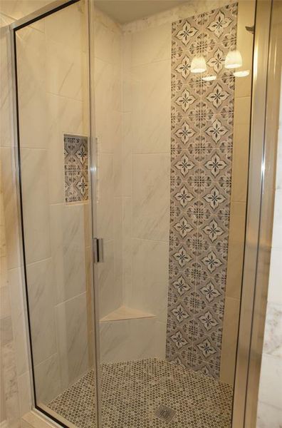 Bathroom with an enclosed shower