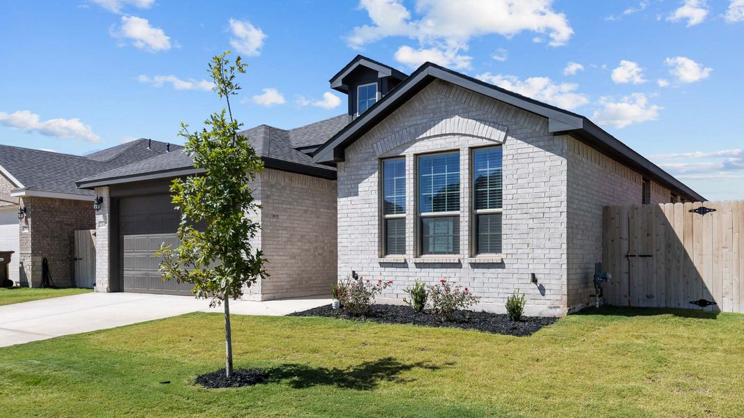 Front exterior of a new home in Northwest Passage, Midland, TX, highlighting curb appeal (Image 2).