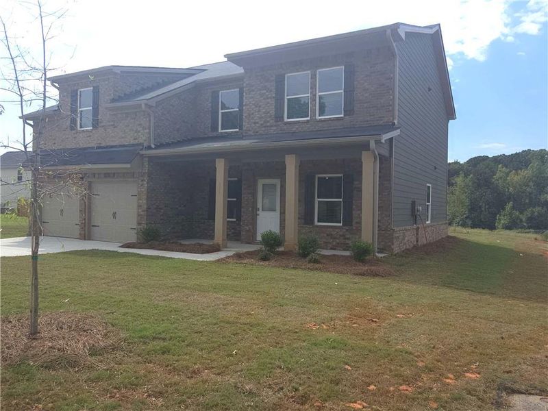 Front exterior of a new home in Southern Hills, McDonough, GA, highlighting curb appeal (Image 15).