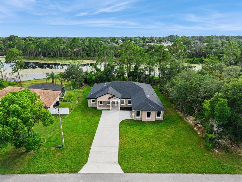 Front exterior of a new home in , Deltona, FL, highlighting curb appeal (Image 16). Front exterior of a new home in , Deltona, FL, highlighting curb appeal (Image 16).