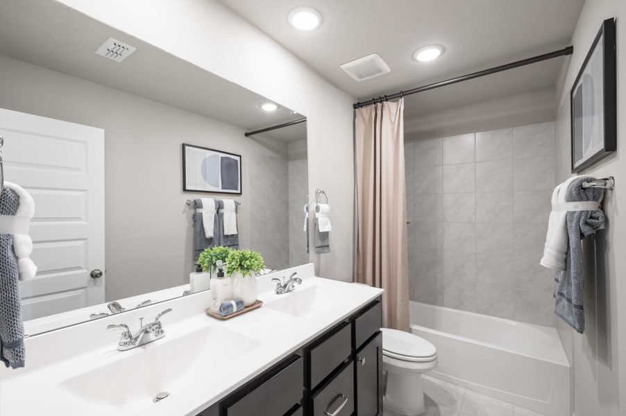 Furnished interior view inside a new home in The Ridge at Mason Woods, Cypress (Image 30). Furnished interior view inside a new home in The Ridge at Mason Woods, Cypress (Image 30).