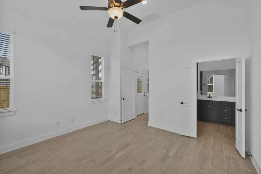 Representative unfurnished interior of a home built from the Versailles by Chesmar Homes in Meridiana Chateau, Manvel (Image 42).