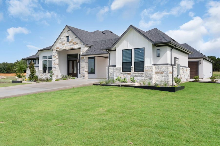Front exterior of a new home in Feathergrass, Florence, TX, highlighting curb appeal (Image 31).