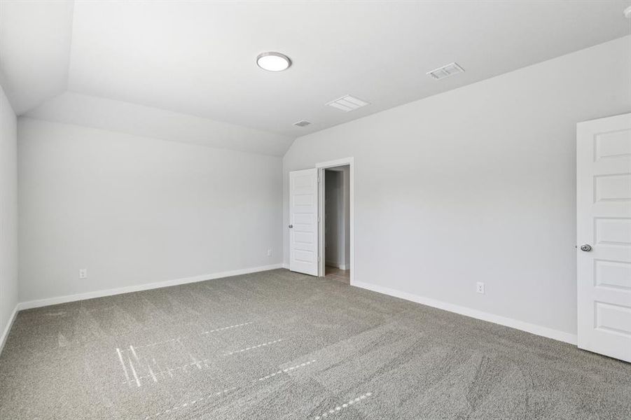 Primary Suite in the Oscar home plan by Trophy Signature Homes – REPRESENTATIVE PHOTO