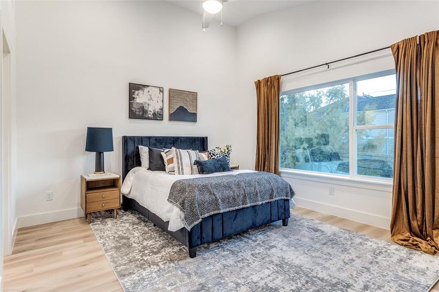 Bedroom featuring wood-type flooring