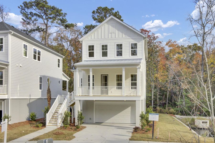Front exterior of a new home in Indigo Grove Single Family Homes, Johns Island, SC, highlighting curb appeal (Image 1).