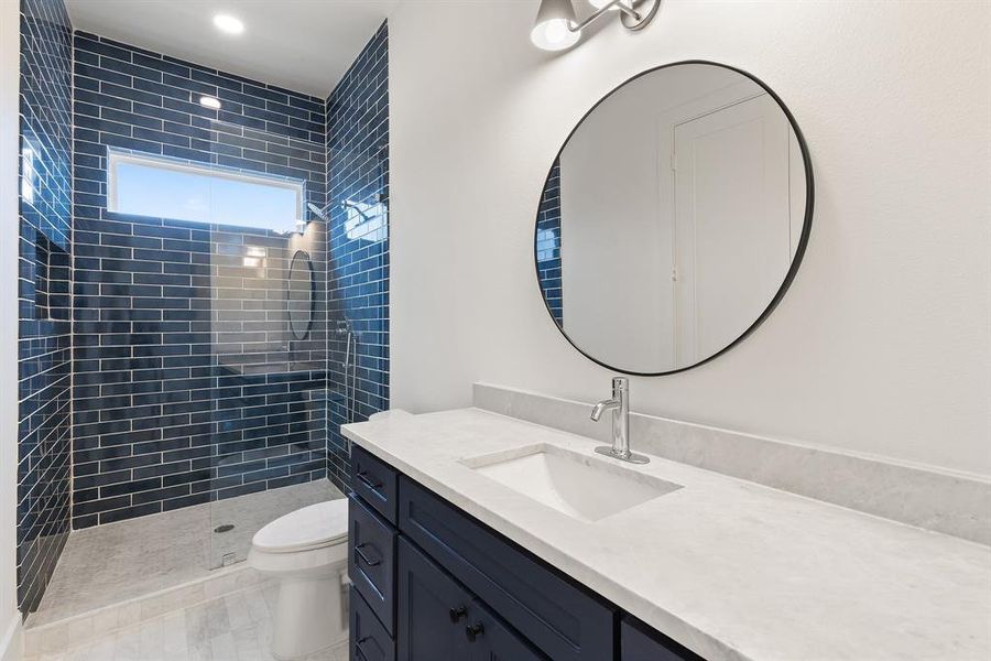 All bathrooms are elegantly appointed with marble countertops.