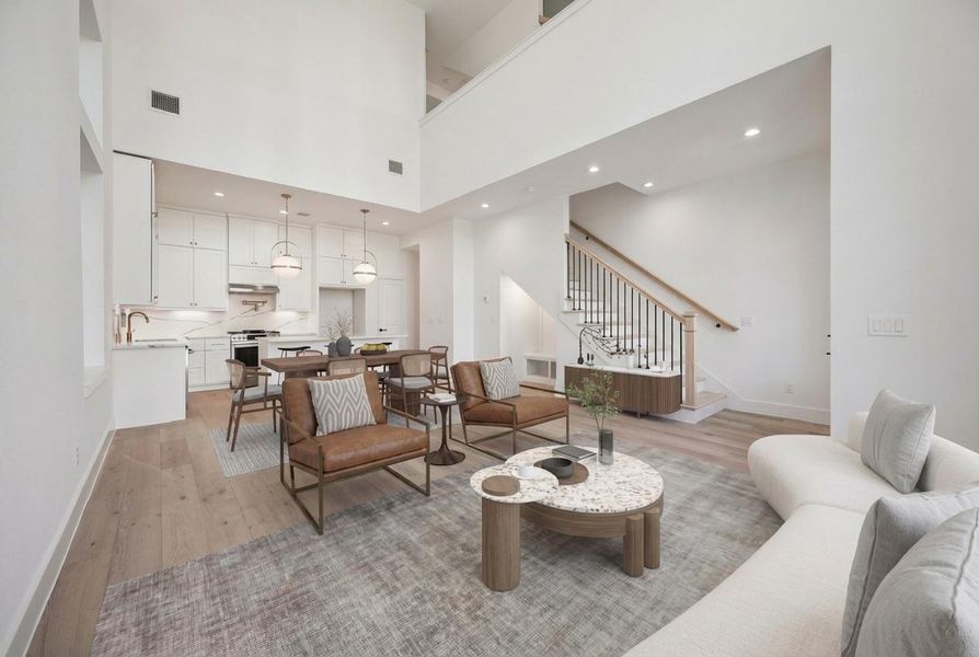 A view from the other angle of your living room, looking back toward the dining room area and the kitchen.