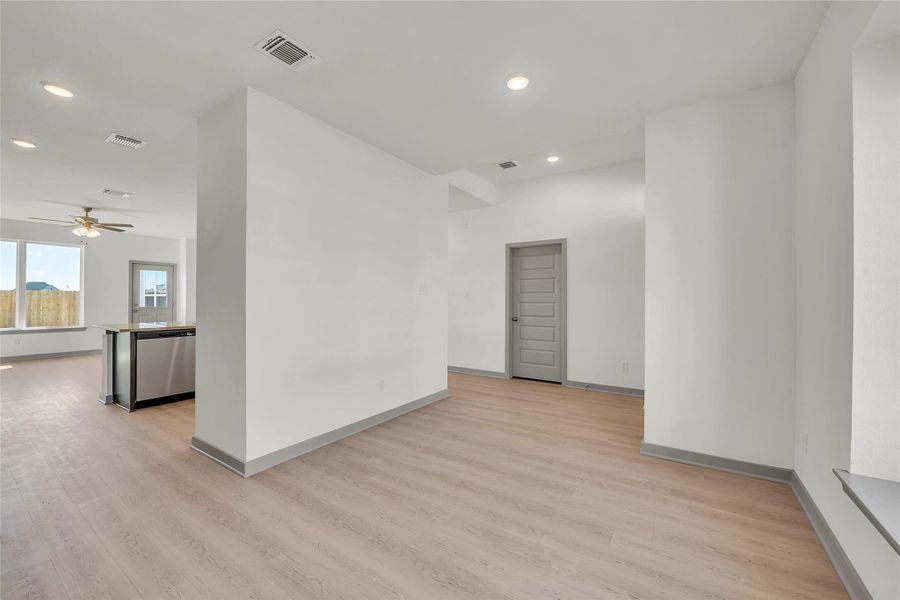 Unfurnished room with recessed lighting, light wood-style flooring, and ceiling fan