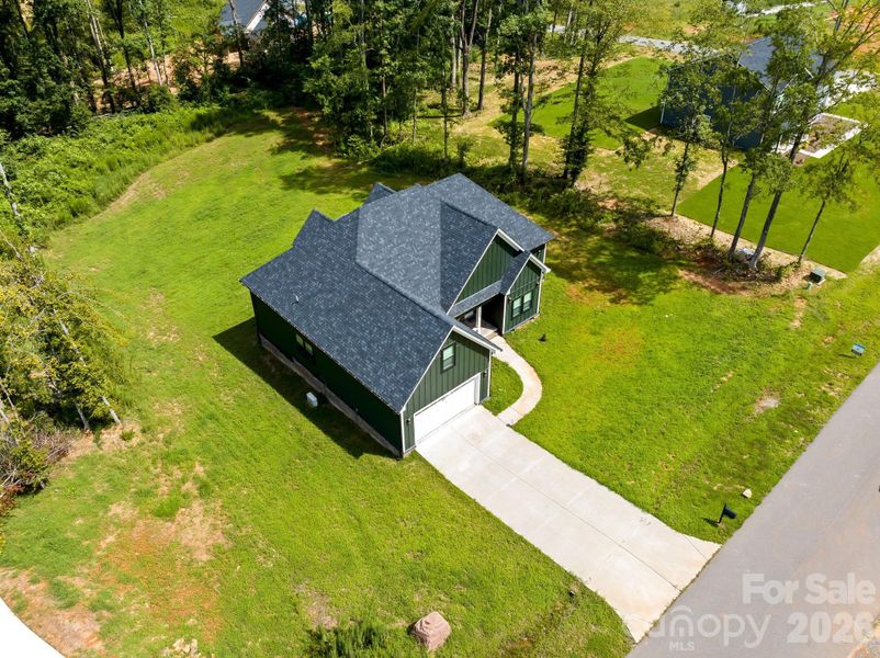 Front exterior of a new home in , Bessemer City, NC, highlighting curb appeal (Image 23).