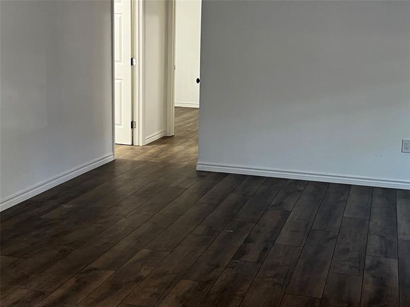 Spare room featuring dark hardwood / wood-style floors