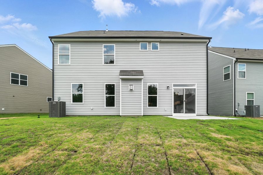 Front exterior of a new home in Hampton Woods, Charlotte, NC, highlighting curb appeal (Image 27). Front exterior of a new home in Hampton Woods, Charlotte, NC, highlighting curb appeal (Image 27).