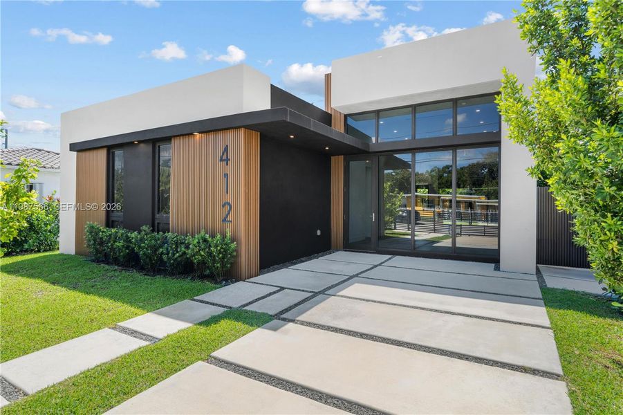 Front exterior of a new home in , Miami, FL, highlighting curb appeal (Image 22).