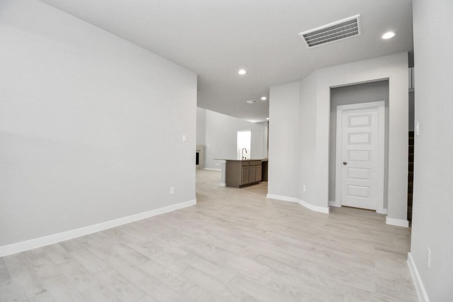 Discover another view of the formal dining area. Sample photo of completed home with similar floor plan. Actual colors and selections may vary.