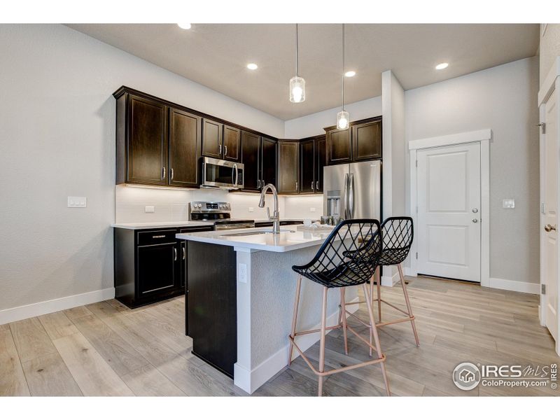 Furnished interior view inside a new home in The Lakes at Centerra - The Shores, Loveland (Image 9).