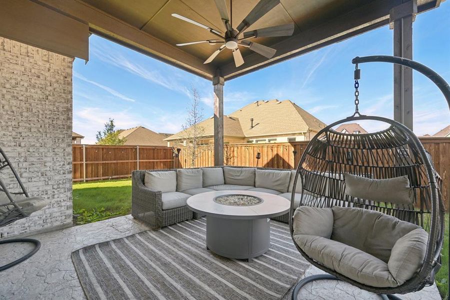 View of patio with a fire pit and ceiling fan