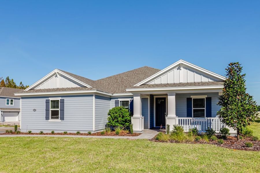 Front exterior of a new home in Headwaters at Lofton Creek, Yulee, FL, highlighting curb appeal (Image 2). Front exterior of a new home in Headwaters at Lofton Creek, Yulee, FL, highlighting curb appeal (Image 2).