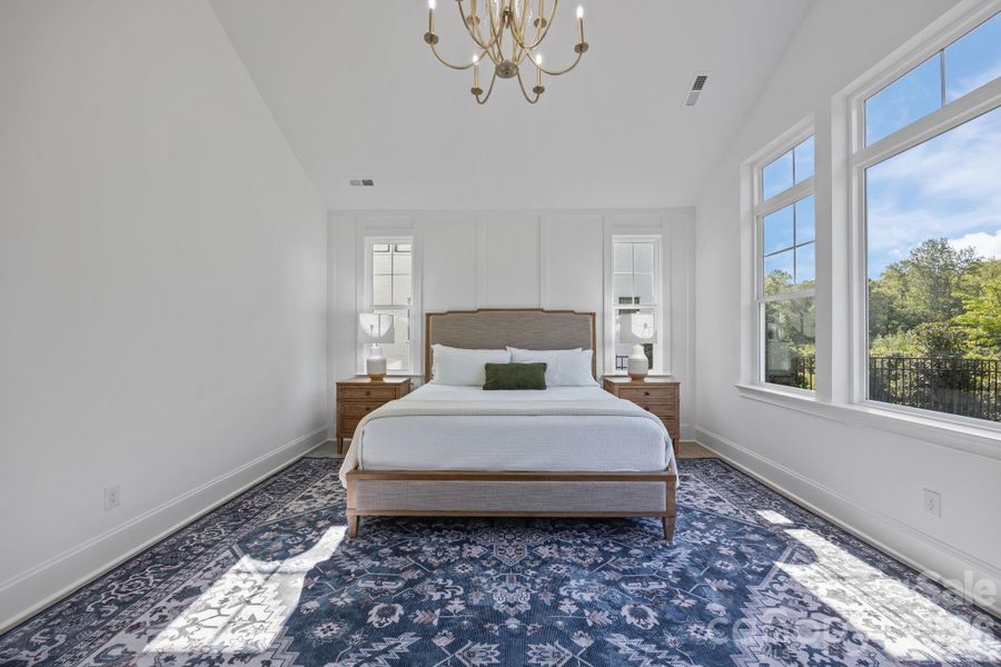 Vaulted ceilings, millwork wall, oversized windows