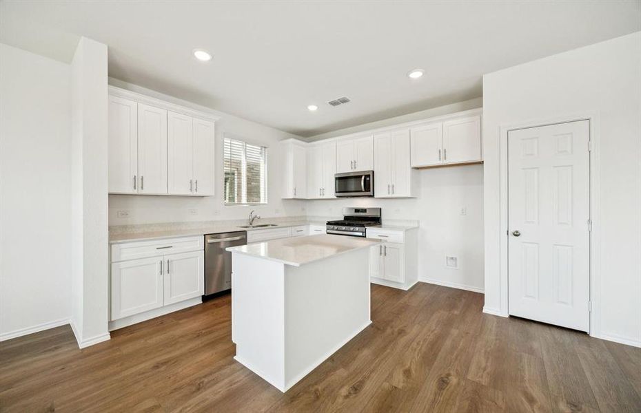 Spacious kitchen with eat-in bartop island
