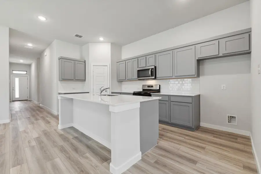 Furnished interior view inside a new home in Prairie Winds, Hutto (Image 4).