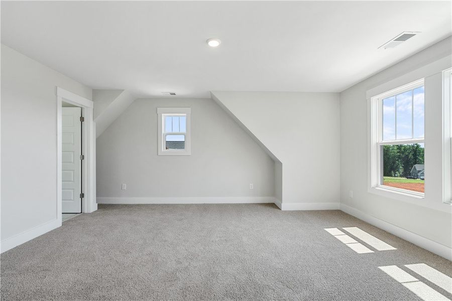 Sunlight streams into this bright, airy room with