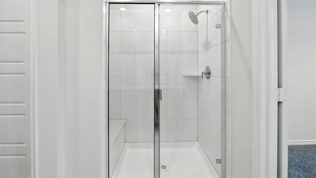 Full bathroom with a shower stall