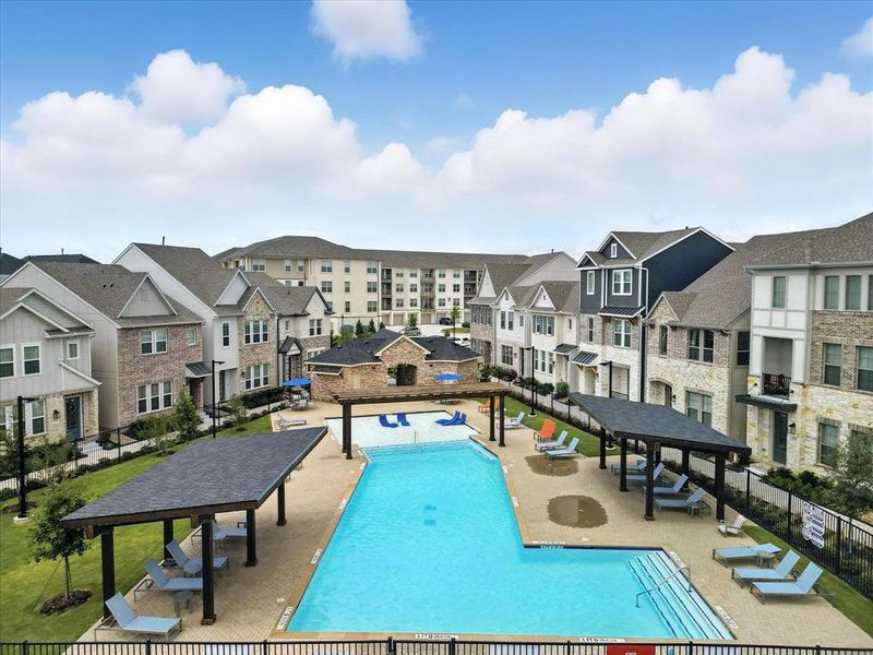 Community pool with a gazebo, a residential view, and a patio area. Situated right opposite to what can be your home. So convenient