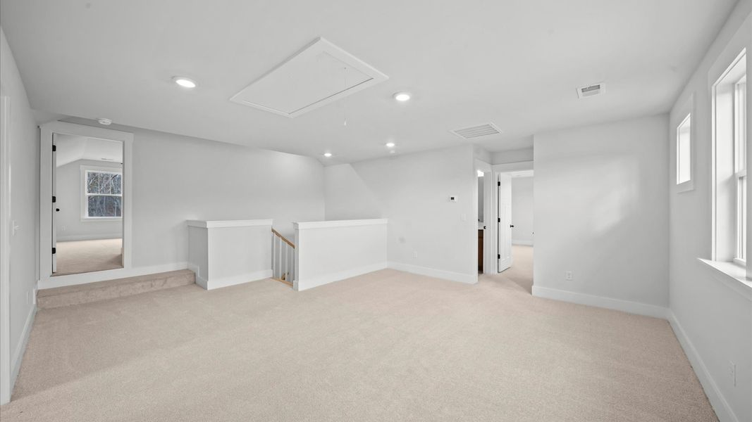 Inviting loft with cozy carpet, perfect for casual gatherings or quiet relaxation