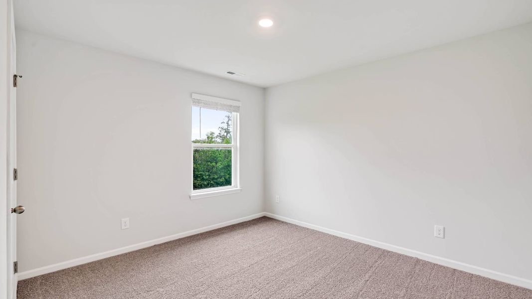 Spacious, unfurnished interior of a new home in Sidbury Station, Castle Hayne (Image 36).