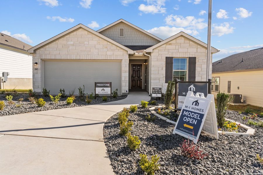 Front exterior of a new home in Hunters Ranch, San Antonio, TX, highlighting curb appeal (Image 27).