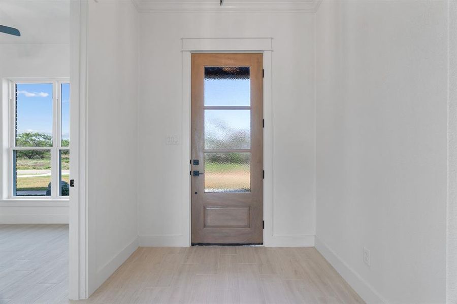 Kitchen with dark cabinets, light countertops, healthy amount of natural light, ceiling fan, and recessed lighting