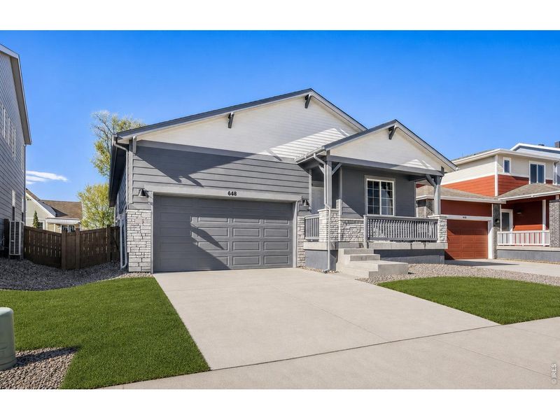 Front exterior of a new home in Trevenna, Windsor, CO, highlighting curb appeal (Image 1). Front exterior of a new home in Trevenna, Windsor, CO, highlighting curb appeal (Image 1).