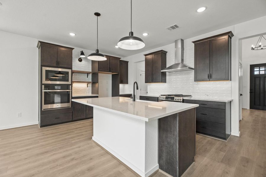 Stunning kitchen with dark stain cabinets and quartz countertops Stunning kitchen with dark stain cabinets and quartz countertops