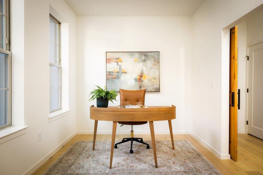 Large dedicated office space with barn doors for privacy. Large dedicated office space with barn doors for privacy.